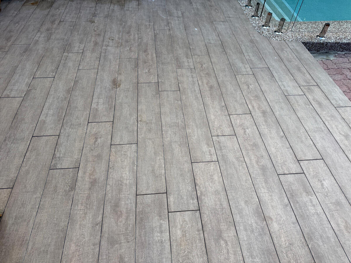 Timber-look tile pool deck — after pressure wash