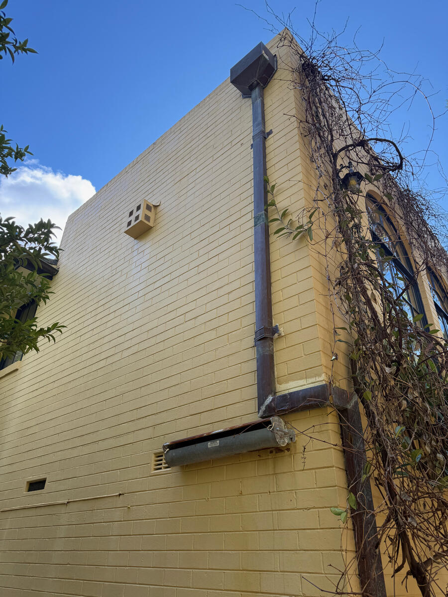 Cream rendered exterior wall — after soft wash