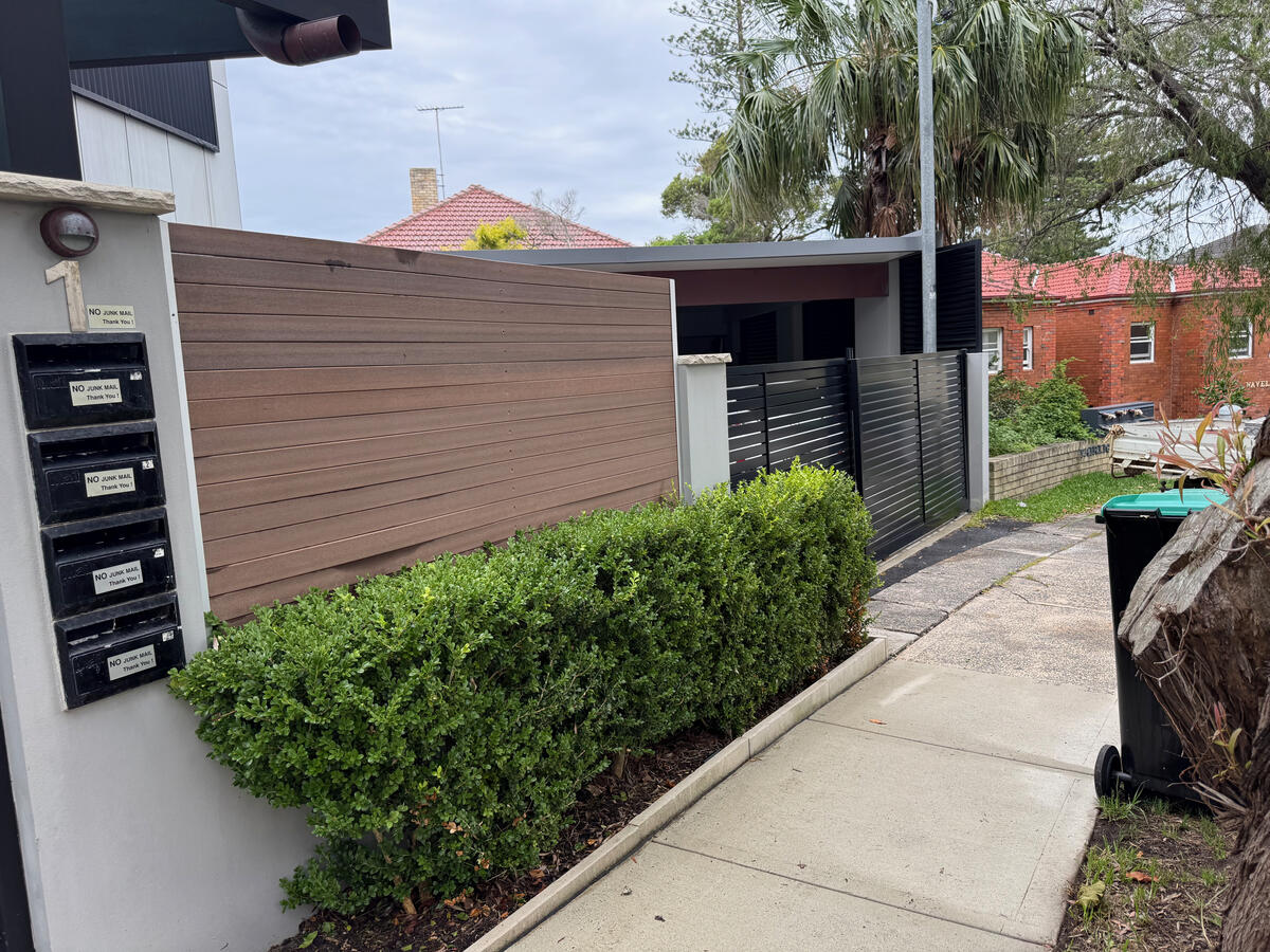 Strata timber entrance and fencing — after soft wash